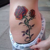 Awesome 3D like big colored realistic roses tattoo on waist