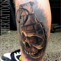 Awesome 3D natural looking grenade tattoo on leg stylized with corrupted skull