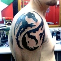 Awesome Asian style black and white dragons Yin Yang symbol shaped arm top tattoo