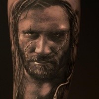Awesome black and gray style tattoo of man face with scars
