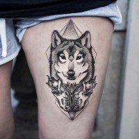Awesome black and white thigh tattoo of wolf portrait with skulls