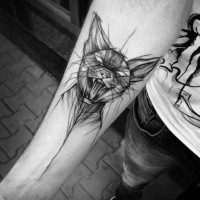 Awesome black ink creepy cat sketch tattoo on forearm