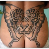 Awesome butterfly transformed into tiger tattoo on lower back