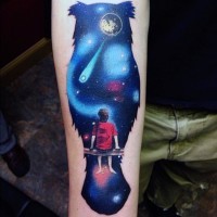 Awesome cartoon style colored owl shaped space with boy tattoo on arm
