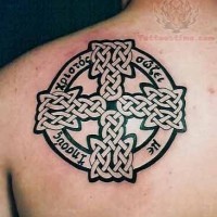 Awesome celtic irish cross tattoo on shoulder blade