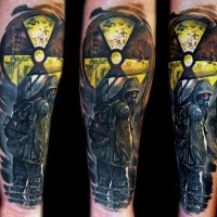Awesome colored arm tattoo of Stalker emblem with man in gas mask