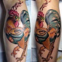 Awesome colored cock in glasses tattoo on leg