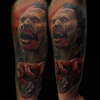 Awesome colored horror style forearm tattoo of creepy monster face