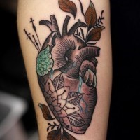 Awesome coloured heart forearm tattoo
