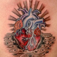 Awesome coloured heart tattoo on chest
