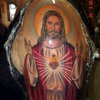 Awesome coloured jesus tattoo on shoulder