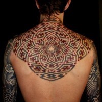 Awesome designed and colored big mystical ornament tattoo on upper back