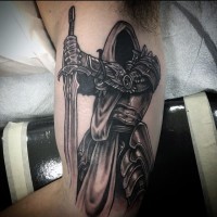 Awesome designed and detailed black and white fantasy mystic warrior with cool sword tattoo on arm