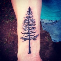 Awesome detailed pine tree dark black ink forearm tattoo