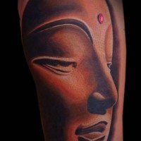 Awesome face of buddha tattoo