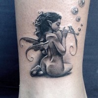 Awesome faerie plays flute tattoo