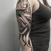 Awesome fantasy style painted by Michele Zingales in black ink on sleeve tattoo of large octopus with human skull