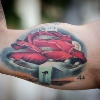 Awesome flower shaped colored alien ship with human tattoo on biceps