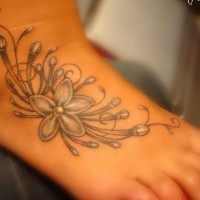 Awesome gray-colored jasmine flower tattoo on foot