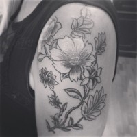 Awesome gray-ink vintage flowers tattoo on upper arm