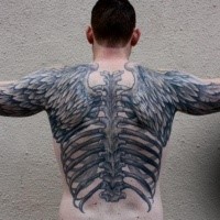 Awesome gray ink work whole back tattoo of fether wings and human skeleton