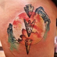 Awesome multicolored arrow head evolution tattoo on thigh with mystic circle