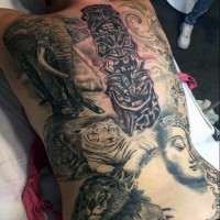 Awesome multicolored big detailed wild animals with tribal statues tattoo on whole back