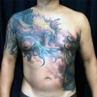 Awesome multicolored bog cock tattoo on upper back