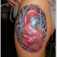 Awesome new school heart tattoo on thigh