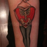 Awesome old school style painted and colored woman with big heart and bones tattoo on arm