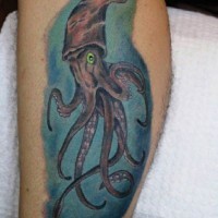 Awesome painted and colored little squid tattoo on leg
