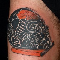 Awesome painted and colored mystical man head with book tattoo on thigh