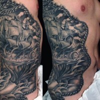 Awesome painted massive black and white old ship with squid tattoo on side