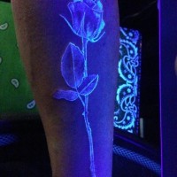 Awesome pretty black light rose tattoo
