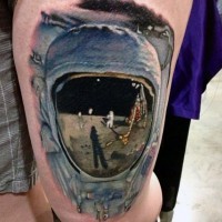 Awesome realistic looking colored astronaut on moon tattoo on thigh