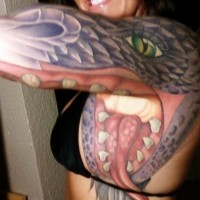 Awesome snake head tattoo on arm