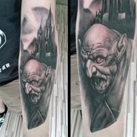 Awesome very detailed and colored night city monster tattoo on arm