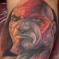 Awesome very detailed colored biceps tattoo of evil barbarian