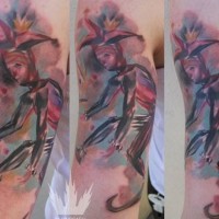 Awesome watercolor clown tattoo on arm