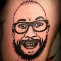 Bald smiling nerd in glasses with beard funny detailed tattoo