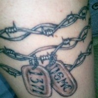 Barbed wire with dog tags tattoo