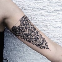 Baroque style black ink arm floral tattoo