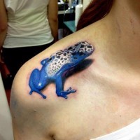 Beautiful blue poisonous frog tattoo on shoulder