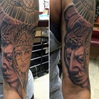 Beautiful accurate painted shoulder tattoo of tribal people portraits and statues