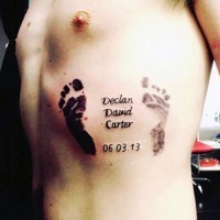 Beautiful baby dedicated foot prints with lettering tattoo on side