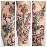 Beautiful black ink engraving style leg tattoo of human heart with flowers