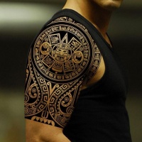 Beautiful black ink god sun aztec prehispanic period tattoo on shoulder