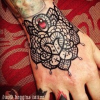 Beautiful black lace tattoo on wrist by David Boggins