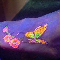 Beautiful butterfly black light tattoo on foot