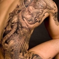 Beautiful chinese lion tattoo on back by Elson Yeo
